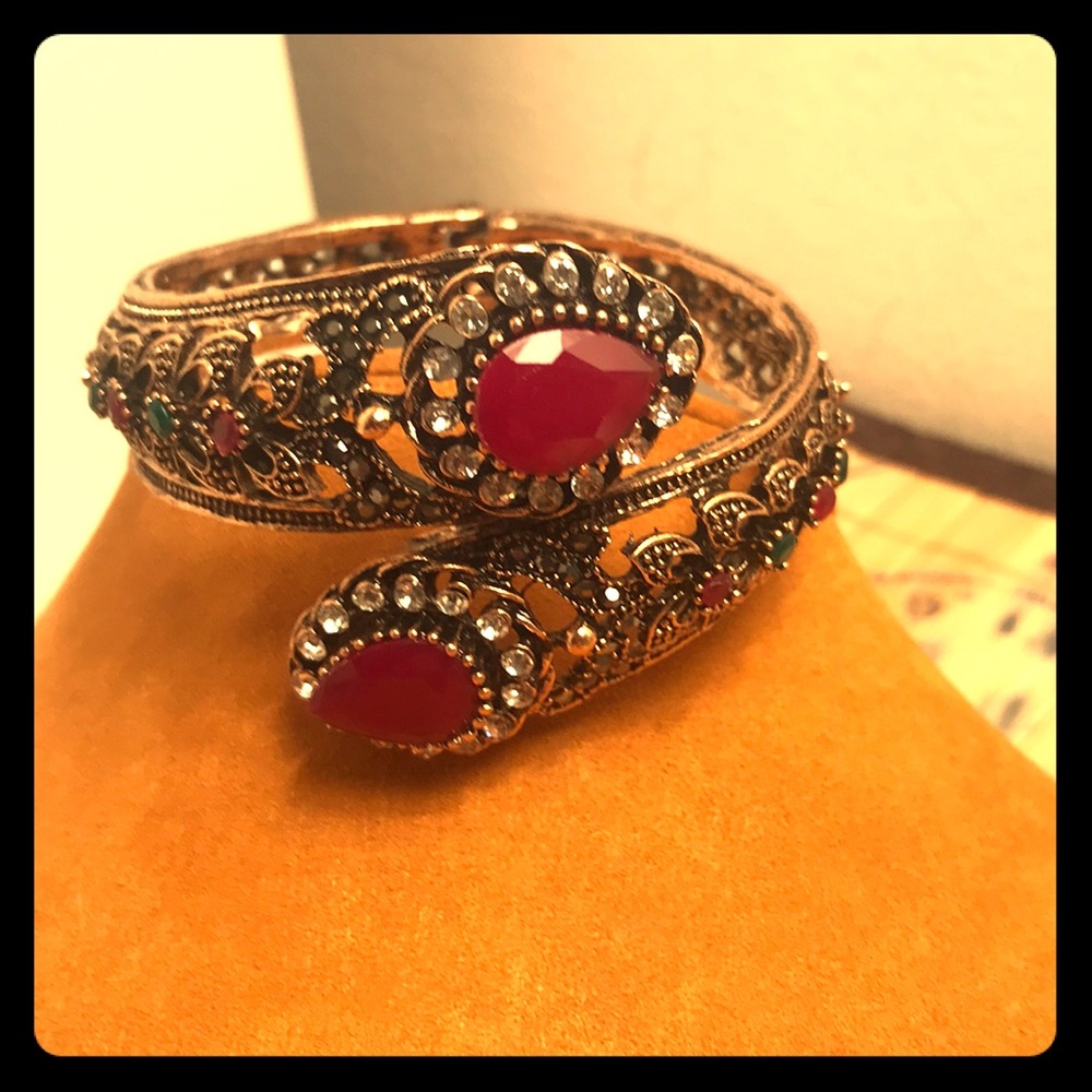 Cuff bracelet with ruby colored gems!